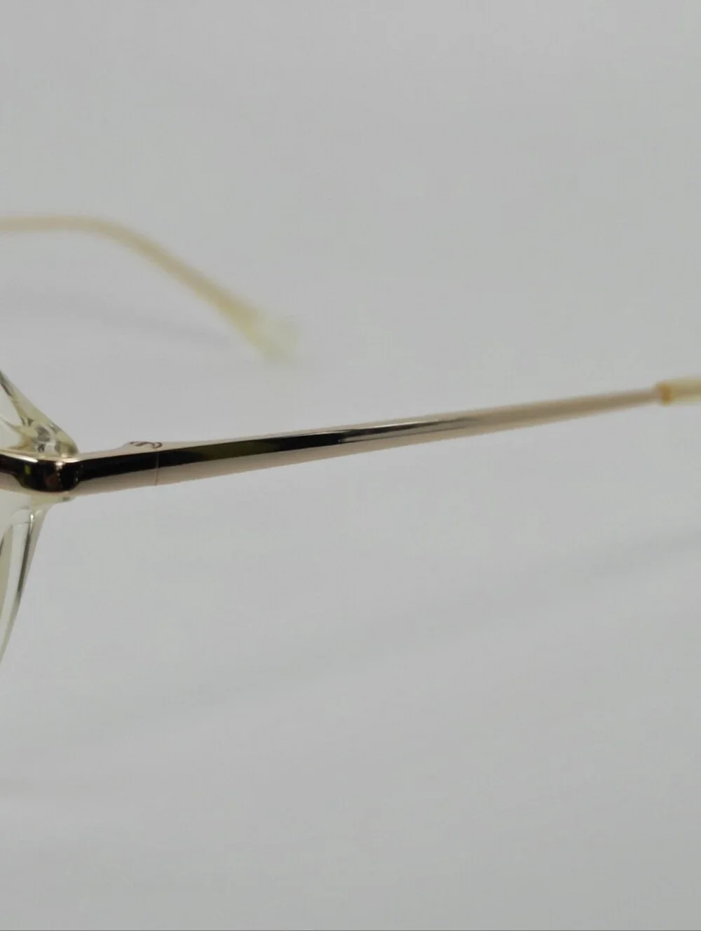 Tamara. Clear Round Frame Glasses. All Gold Accents are Metal.